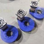Helical gear slewing drive solutions with large gear ratio reducers