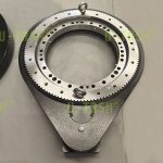 Two-stage slewing drive with extended center distance and high precision